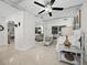 Open concept bedroom with daybed and access to living area at 2907 Marshall Dr, Sarasota, FL 34239