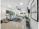 Open living area featuring a light teal sofa and TV at 2907 Marshall Dr, Sarasota, FL 34239