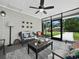 Bright and airy screened porch with comfortable seating at 2907 Marshall Dr, Sarasota, FL 34239