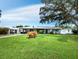 Charming single story home with lush lawn and mature landscaping at 2907 Marshall Dr, Sarasota, FL 34239