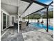 Relaxing poolside patio with seating and a covered area at 2907 Marshall Dr, Sarasota, FL 34239