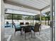 Enjoy this covered patio area with seating overlooking the pool at 2907 Marshall Dr, Sarasota, FL 34239
