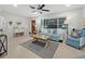 Relaxing living room with light teal accents and wood floors at 2907 Marshall Dr, Sarasota, FL 34239