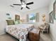 Guest bedroom with a queen bed and charming decor at 2907 Marshall Dr, Sarasota, FL 34239