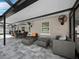 Covered patio with comfortable seating and ceiling fan at 2907 Marshall Dr, Sarasota, FL 34239