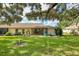 Backyard with patio and sliding glass doors to home at 3541 Wilkinson Woods Dr # 40, Sarasota, FL 34231