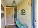 Inviting entryway with seating and unique decor at 3541 Wilkinson Woods Dr # 40, Sarasota, FL 34231