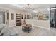 Bright living room features a large mirror and stylish furniture at 3541 Wilkinson Woods Dr # 40, Sarasota, FL 34231