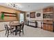 Cozy dining room with neutral walls, stylish furniture and decorative wall hangings at 3541 Wilkinson Woods Dr # 40, Sarasota, FL 34231