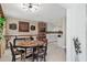 Dining room features neutral walls, stylish table and chairs with built ins at 3541 Wilkinson Woods Dr # 40, Sarasota, FL 34231