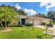Well-maintained single-story home with lush landscaping and a two-car garage at 3541 Wilkinson Woods Dr # 40, Sarasota, FL 34231