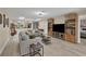 Open concept living area featuring wood built ins, skylights, neutral walls and stylish furniture at 3541 Wilkinson Woods Dr # 40, Sarasota, FL 34231