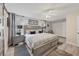 Spacious main bedroom with a king-size bed and updated flooring at 3541 Wilkinson Woods Dr # 40, Sarasota, FL 34231