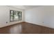 Empty bedroom with window and flooring at 3601 Quail Hollow Ln, Bradenton, FL 34210