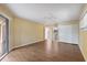 Bedroom with laminate floors, ceiling fan, and access to bathroom and screened porch at 3601 Quail Hollow Ln, Bradenton, FL 34210