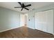 This empty bedroom offers a ceiling fan and closet space at 3601 Quail Hollow Ln, Bradenton, FL 34210