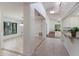 Bright and airy interior view showcasing the dining area, hallway, and open kitchen concept at 3601 Quail Hollow Ln, Bradenton, FL 34210