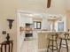 Updated kitchen featuring granite countertops, stainless steel appliances, and breakfast bar seating at 3601 Quail Hollow Ln, Bradenton, FL 34210