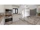 Updated kitchen featuring granite countertops, stainless steel appliances, and bright white cabinetry at 3601 Quail Hollow Ln, Bradenton, FL 34210