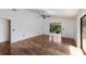 This bright living room offers hardwood floors, vaulted ceilings, and a view of the lanai at 3601 Quail Hollow Ln, Bradenton, FL 34210