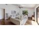 Bright living room with vaulted ceiling, ceiling fan, hardwood floors, and access to the lanai at 3601 Quail Hollow Ln, Bradenton, FL 34210