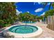 Relaxing pool and spa area features clear water, brick pavers, and comfortable lounge chairs at 3601 Quail Hollow Ln, Bradenton, FL 34210