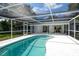 Inviting kidney-shaped pool with screened enclosure at 4724 Seville Dr, Sarasota, FL 34235