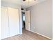Bright bedroom with double closets and wood-look flooring at 5933 17Th W St # A24, Bradenton, FL 34207