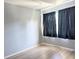 Bedroom with window, curtains, and wood-look flooring at 5933 17Th W St # A24, Bradenton, FL 34207