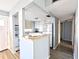 Galley kitchen with white cabinets and modern appliances at 5933 17Th W St # A24, Bradenton, FL 34207