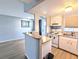 Open kitchen with breakfast bar and modern appliances at 5933 17Th W St # A24, Bradenton, FL 34207