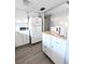 Updated kitchen, white cabinets, and modern appliances at 5933 17Th W St # A24, Bradenton, FL 34207
