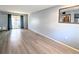 Bright and airy living room with wood-look flooring at 5933 17Th W St # A24, Bradenton, FL 34207