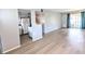 Spacious living room featuring light gray walls and wood-look flooring at 5933 17Th W St # A24, Bradenton, FL 34207