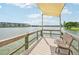 Peaceful lakeside dock with shaded seating area at 3777 Lake Bayshore Dr # H401, Bradenton, FL 34205