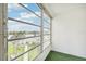 Sunroom with artificial turf flooring and water views at 3777 Lake Bayshore Dr # H401, Bradenton, FL 34205