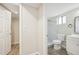 Clean bathroom with toilet, shower, and vanity at 3777 Lake Bayshore Dr # H401, Bradenton, FL 34205