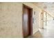 Building hallway with elevator access at 3777 Lake Bayshore Dr # H401, Bradenton, FL 34205