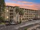 Condominium building with parking and landscaping at 3777 Lake Bayshore Dr # H401, Bradenton, FL 34205