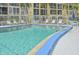 Refreshing community pool with lounge chairs at 3777 Lake Bayshore Dr # H401, Bradenton, FL 34205