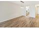 Dining room with wood-look flooring and kitchen access at 3777 Lake Bayshore Dr # H401, Bradenton, FL 34205