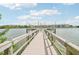 Community dock extending over calm lake waters at 3777 Lake Bayshore Dr # H401, Bradenton, FL 34205