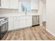 Modern kitchen with white cabinets and stainless steel appliances at 3777 Lake Bayshore Dr # H401, Bradenton, FL 34205