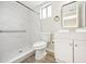 Updated bathroom with walk-in shower and modern vanity at 3777 Lake Bayshore Dr # H401, Bradenton, FL 34205