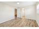 Spacious bedroom with wood-look floors and access to hallway bathroom at 3777 Lake Bayshore Dr # H401, Bradenton, FL 34205