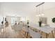 Open concept living and dining area with light flooring and modern decor at 3777 Lake Bayshore Dr # H401, Bradenton, FL 34205