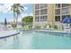 Inviting community pool with ample seating at 3777 Lake Bayshore Dr # H401, Bradenton, FL 34205