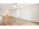 Spacious living room with light walls and laminate wood flooring at 3777 Lake Bayshore Dr # H401, Bradenton, FL 34205