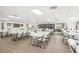 Spacious community room with tables and chairs at 3777 Lake Bayshore Dr # H401, Bradenton, FL 34205