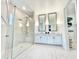 Large bathroom with double vanity and a walk-in shower at 1922 6Th St E, Palmetto, FL 34221